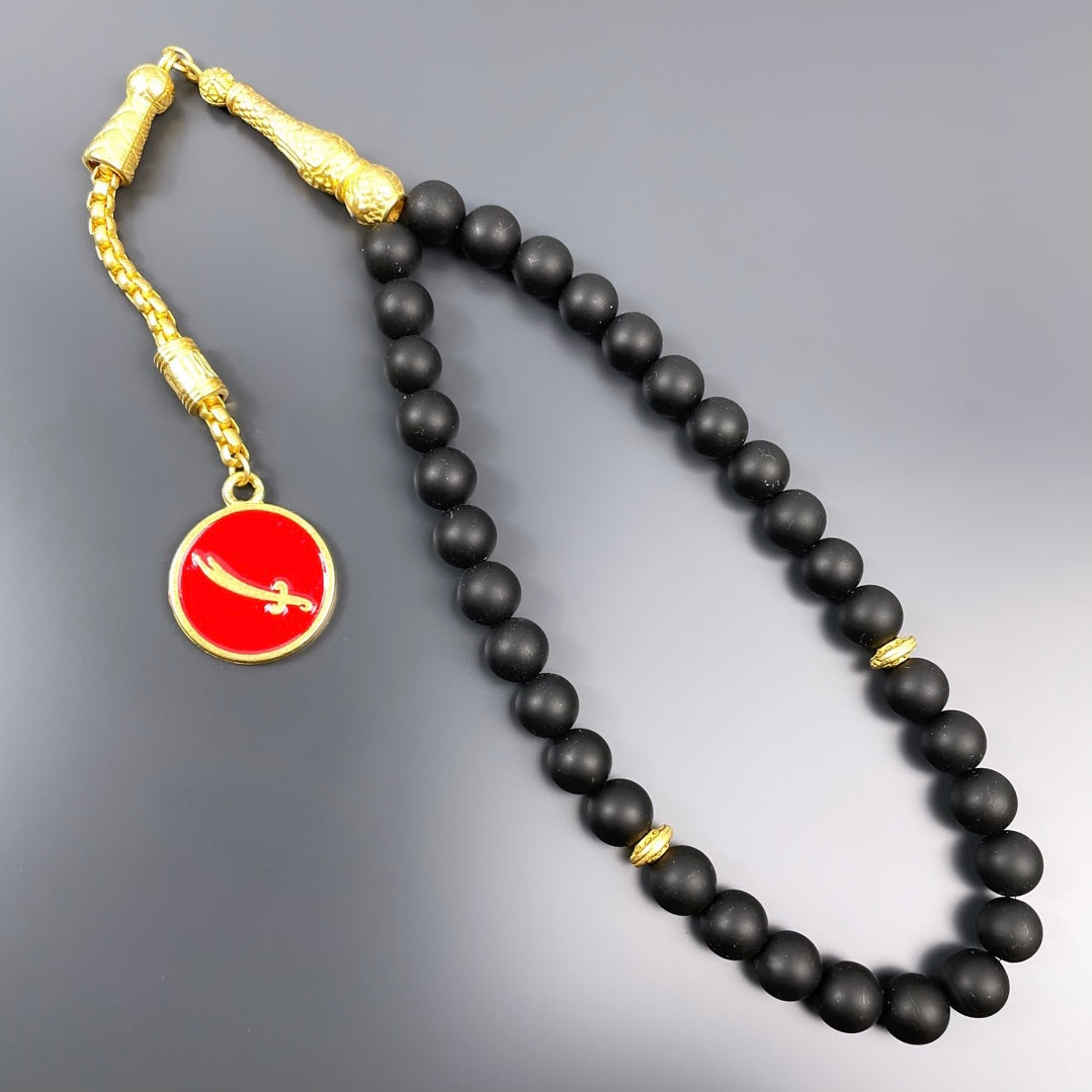 Onyx Dogaltas Tesbih / Gebetskette Kilic Logo
