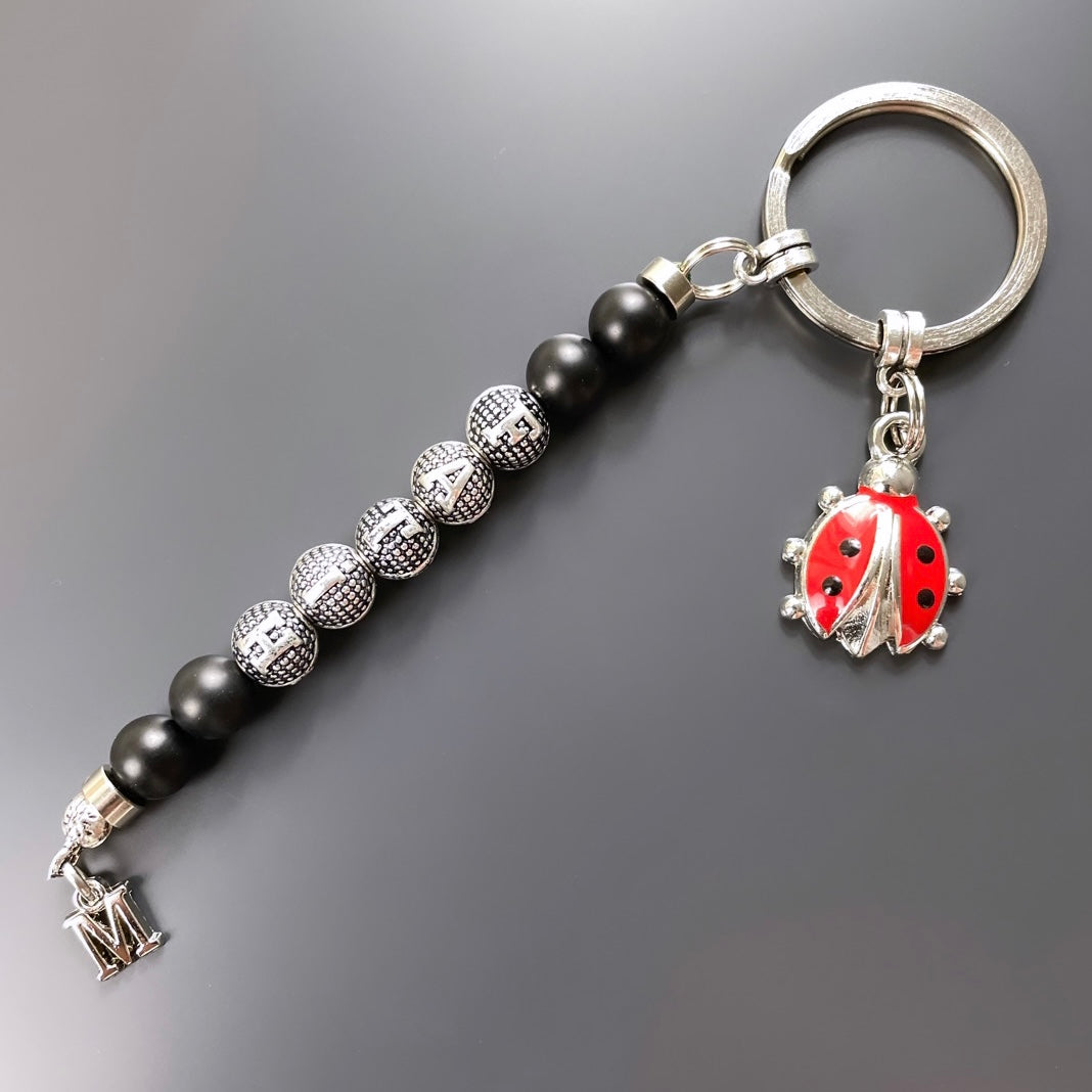 Schlüsselanhänger Marienkäfer Logo